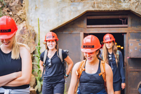 Tour group in front of tunnel entrance of Argo Gold Mill. Explore a treasure trove of Colorado heritage at the Argo Gold Mill Museum in Denver Mountain Area, Colorado.