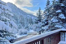 View from balcony of Vacation Suites in the wintertime at Aspen Winds on Fall River Vacation Suites in Estes Park, Colorado.