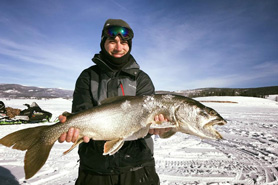 Man holding fish at 3-Lakes fishing tournament in Granby, Colorado