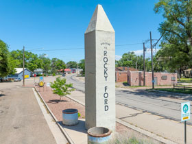 Welcome sign-post at the entrance to Rocky Ford, Colorado.
