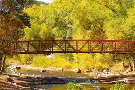 Black Bear Hole Bridge crossing above the St. Vrain Creek during the fall near Lyons, Colorado.