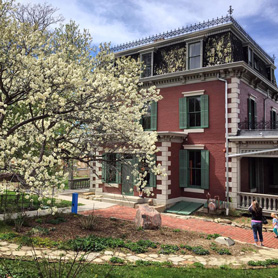 Family taking pictures of the Baca House in Trinidad, Colorado.