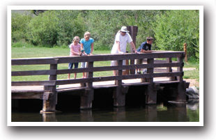 People on dock at a fishing pond in Nederland, Colorado.