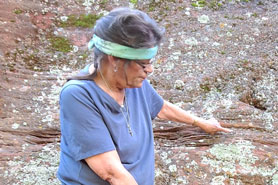 Tour guide pointing to fossils at Indian Springs Trace Fossil Site near Canon City, Colorado.