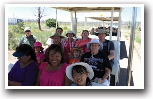 Family riding a tour shuttle in Mesa Verde National Park, Colorado.