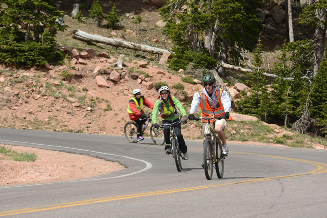 Bikers going down Pikes Peak with Pikes Peak Bike Tours near Colorado Springs, Colorado