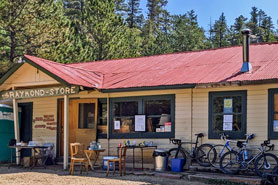 Mountain-bikes parked outside of the Raymond Store between Lyons and Allenspark, Colorado.