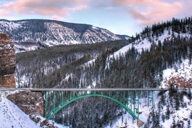 Snow capped mountain range in the background of the Red Cliff Steel Bridge along the Top of the Rockies Scenic Byway, Colorado.